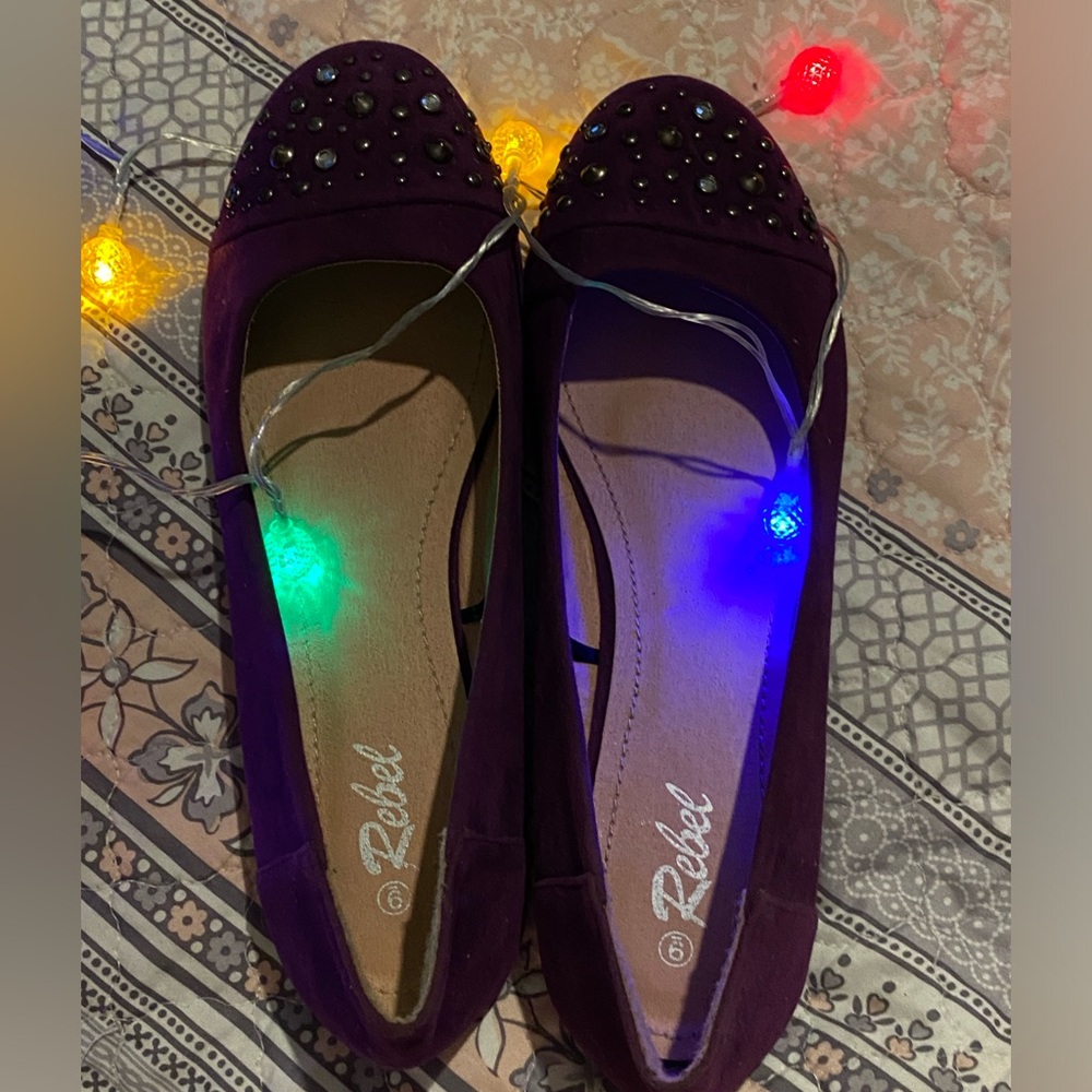 Rebel purple flat slip ons.